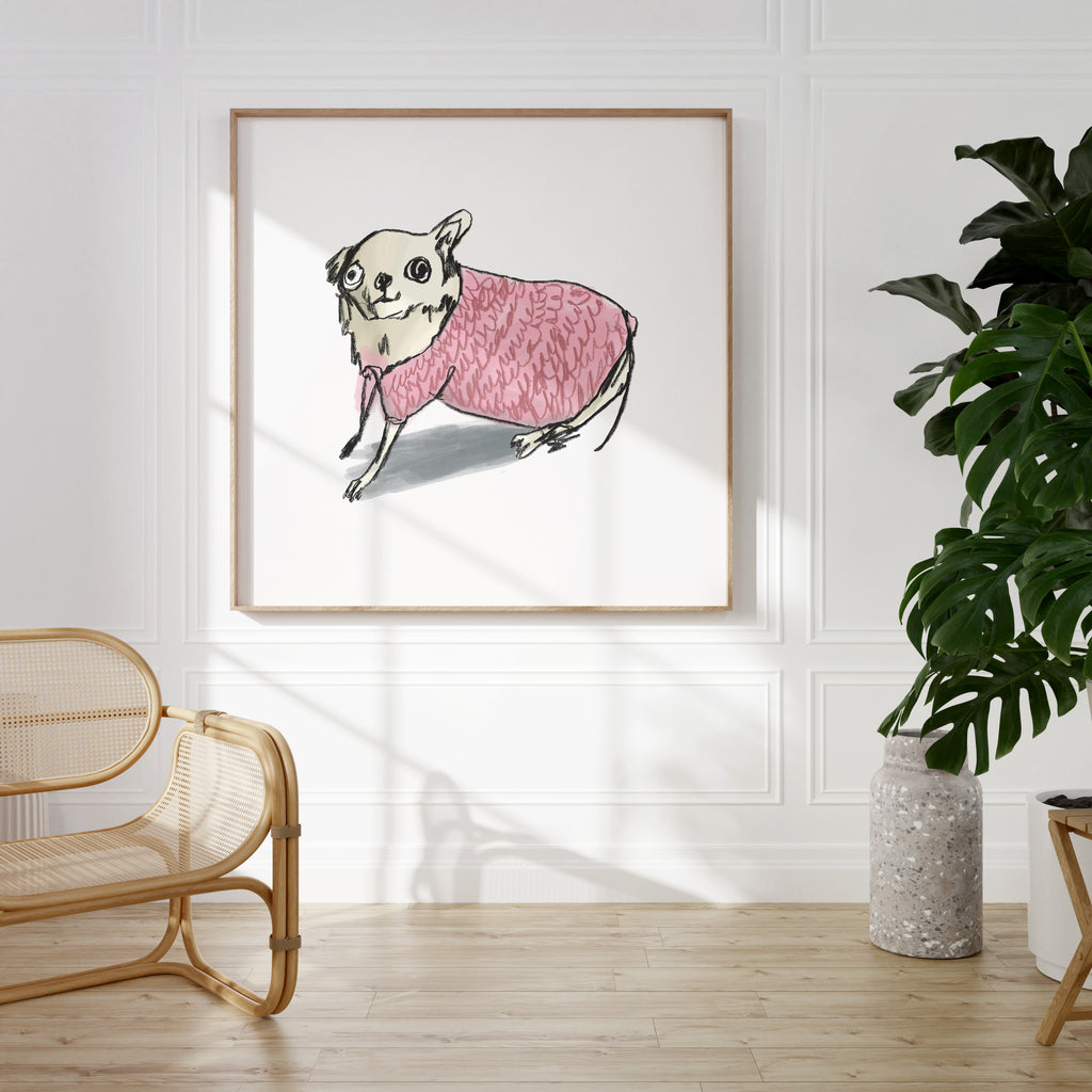 Drawing of a beige Chihuahua in pink jumper on white background in an oak frame hanging on a wall