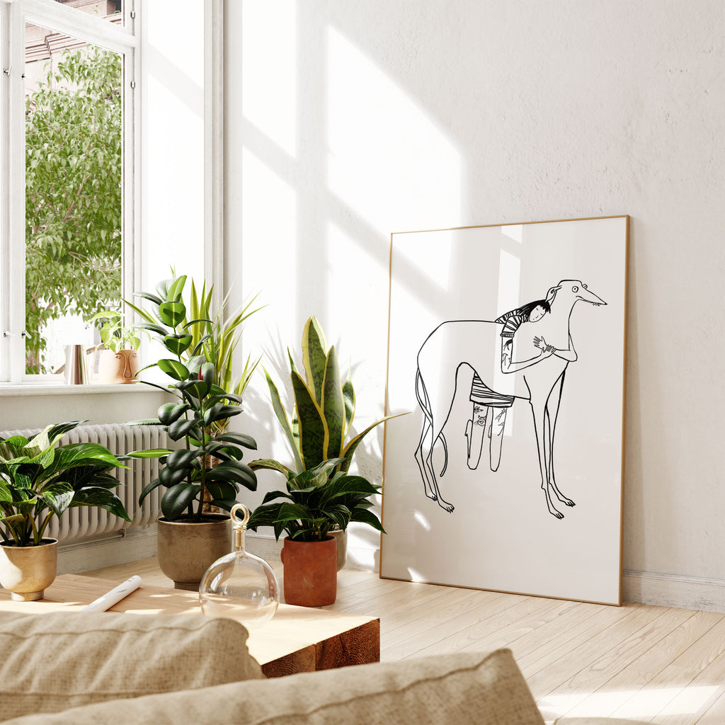 Black line drawing of tattooed girl in stripy dress hugging large greyhound/lurcher/sighthound on white background print on floor in sun room with plants