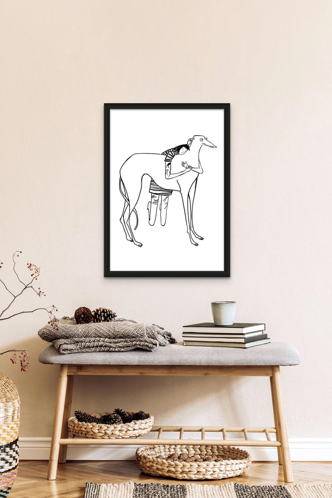 Black line drawing of tattooed girl in stripy dress hugging large derpy greyhound/lurcher/sighthound on white background print in black frame hanging on wall